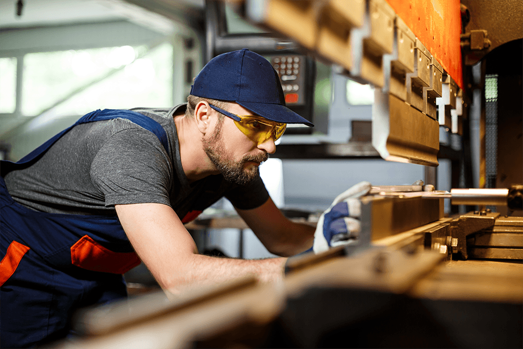 Craftsman operating a CNC workshop machine